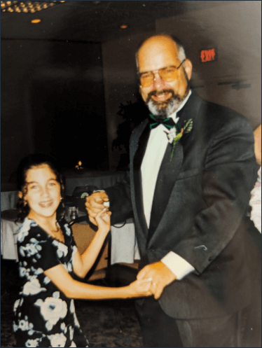 photo of a young Heather dancing with her father